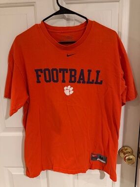 Clemson Nike Orange Tee with black 'FOOTBALL' and White Paw